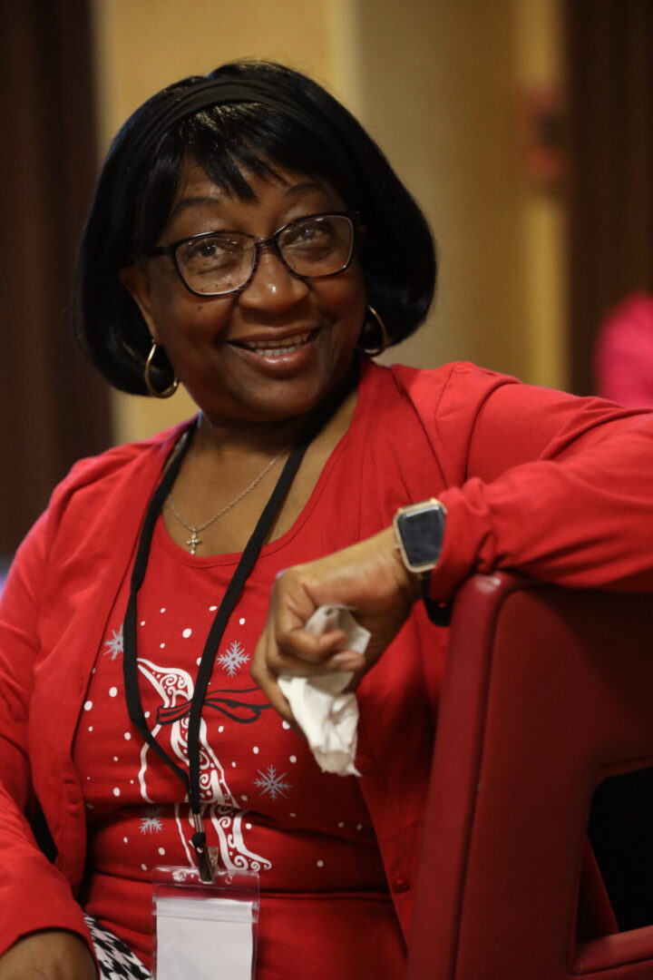 Happy woman wearing red and black glasses