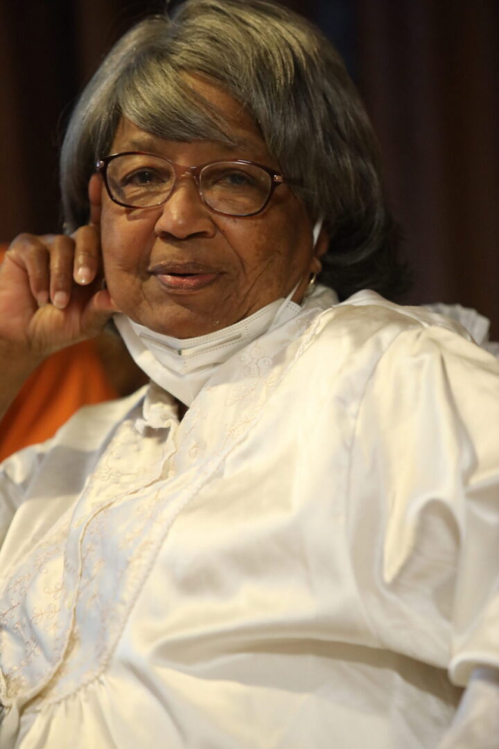 Senior woman sitting with hand on face