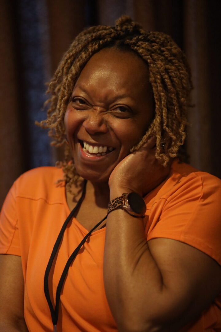 Woman laughing joyfully indoors