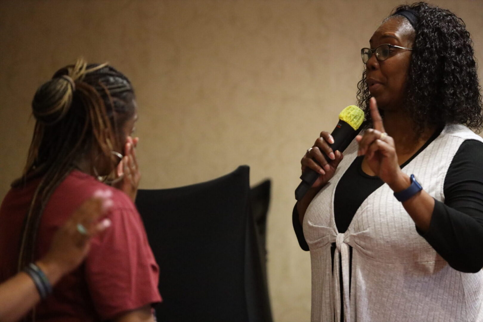 Woman speaking into microphone