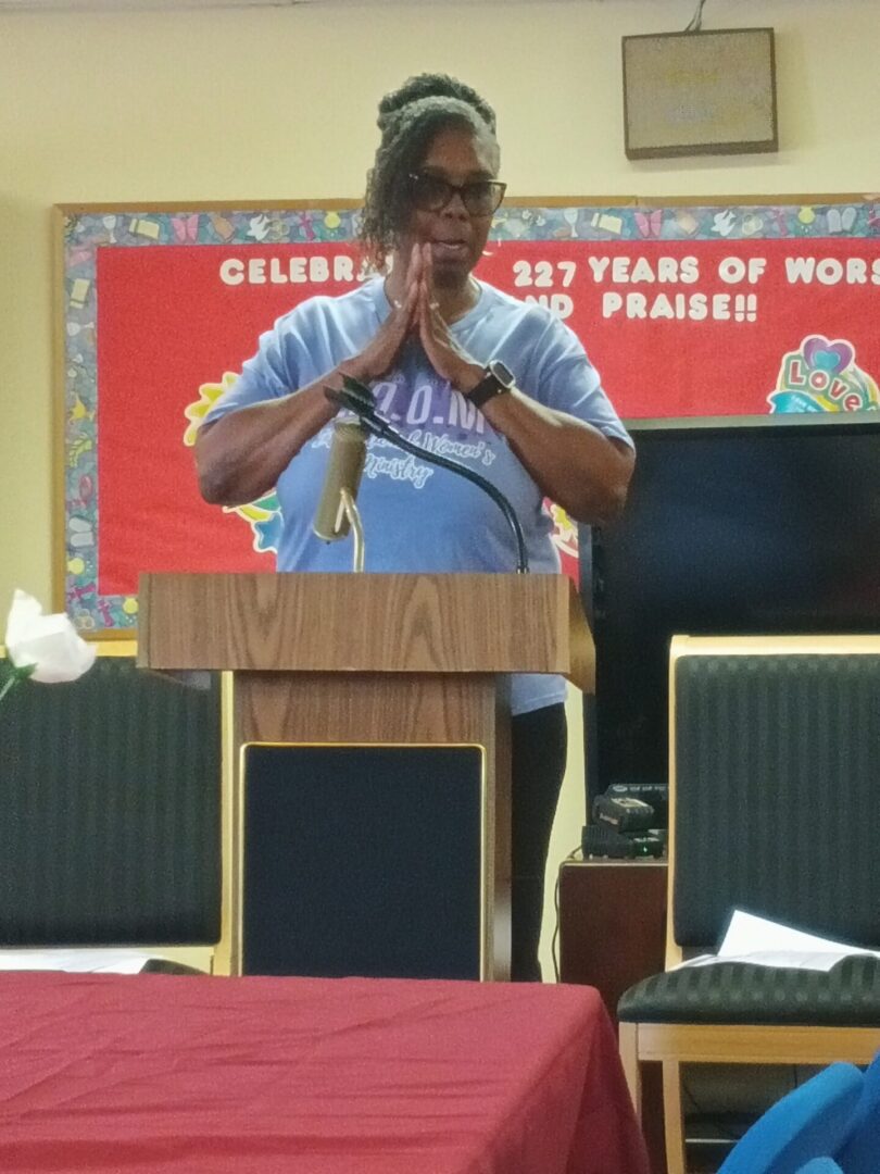 Woman speaking at a podium